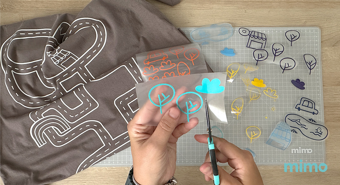 Recortando os tranfers com a tesoura de precisão